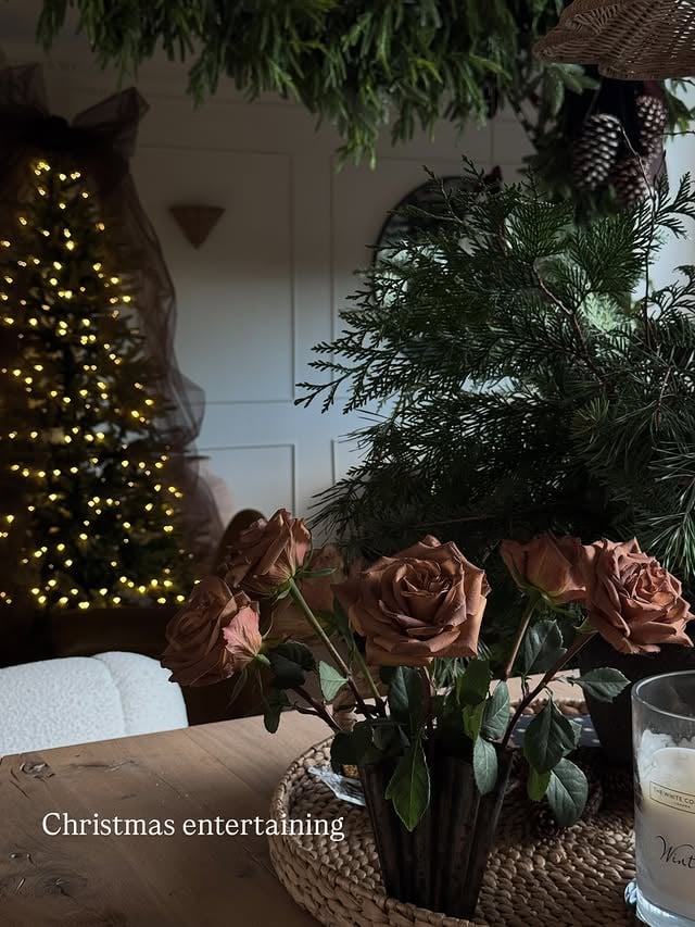I love to entertain and enjoy preparing and styling food and drinks as much as the event itself. Sharing a few pics from a Christmas drinks party I hosted last night.I draped the main table with chocolate brown satin material and layered it up with various dishes. There was a mixture of loose items in amongst the platters such as gilded pomegranates, gold wrapped chocolate coins, cones, foliage and a few of my chocolate coloured roses 🤎Making the cherry and clementine cones did take a while but they definitely drew the eye so I was pleased I made the effort.Any questions let me know.I now need to turn my attentions to the main day but a lazy day today and out for Sunday lunch as I’m feeling a tad fragile! Have a good one x#christmasentertaining #entertainingideas #hosting #drinksparty