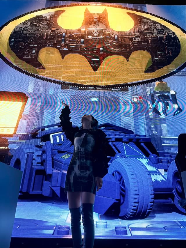 I'm so lucky I got invited to the lego batman event by @alienware and @wbgames 🦇🦇🦇 I grew up watching so many animated DC shows and movies and played the Arkham trilogy twice over so I was over the moonThey had so many props and also real suits worn by pattison, bale, and keaton. I also recently watched Batman (1989) and Batman Returns (1992) and I highly recommend Batman Returns specifically because it is hilariously entertaining LOLanyways cant wait to talk about everything and play the game soon 🖤💙 (i also did take a bunch of their decorative props like iceberg lounge coasters and the gotham globe newspaper 🤫)I specifically picked this spiky outfit in reference to Absolute Batman's spiky suit design!!jacket @junyawatanabe dress @jeanpaulgaultier boots @mm6maisonmargielajewelry @chromeheartsofficial by @39daph