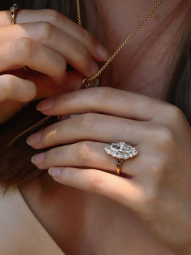 S H A L O M ✨🌸🕯️ We love the remarkable sense of history woven into this piece. The softly pinky-hued vintage marquise finds an effortless home within its rare antique Victorian setting, framed by chunky old-cut diamonds that speak to the craftsmanship and romance of another era. The marriage of these two historical elements feels almost destined — as though they have belonged together for centuries.•••#engagementring #ringinspo #antique #victorianjewelry #marquise by @andriabarbonejewelry