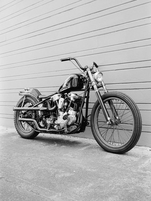 I wanted to share some photos of this bike. 1944 EL KNUCKLEHEAD-WAR AND PEACE- and a small part of the process which a maximum of 20 photos is not nearly enough. I took all these film photographs throughout the process. I built this for. @prideofgypsies for his HBO  show @on_the_roam . It was a really cool experience. The brass style plated frame with black lacquer on top of it was an nod to the vintage @leica_camera . I didn’t get anything chrome plated. I did all the Parkerizing in the backyard and the things that I couldn’t fit in Walter Whites solution I used gun metal bluing. I used these processes on every spoke, most every nut and bolt. I wanted that to play with all the natural aluminum of the engine. And added a tasteful amount of brass to go with the vard and linkert. 
I even used some old used parts that had been painted with lacquer., like the oil bag, and the primary cover. They already had the look. I plan on taking this down to @bornfreeshow so people can take a look at it.  #4qconditioning